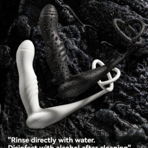 Elegant adult toys on a textured black surface, emphasizing hygiene with cleaning instructions.