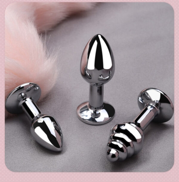 Shiny metallic anal plugs in unique shapes, perfect for enhanced pleasure and comfort.