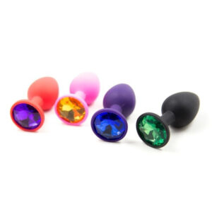 Kleurrijke siliconen buttplugs met edelsteenaccenten, perfect voor speelse avonturen en persoonlijke stijl.