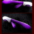 Curved purple sex toy with ergonomic design, glossy finish, and textured surface for enhanced pleasure.