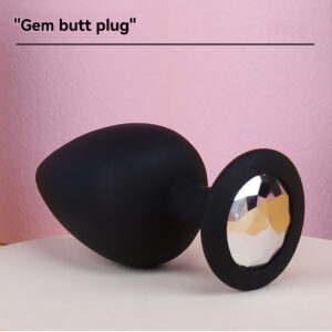 Elegant perle buttplug i mat sort med en funklende ædelsten for ekstra glamour.