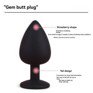 Strawberry-shaped black silicone gem butt plug for pleasure and comfort during use.