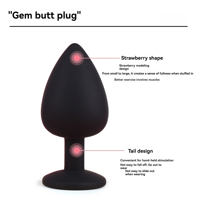 Plug anal en forma de gema de silicona negra con forma de fresa para mayor placer y comodidad durante su uso.