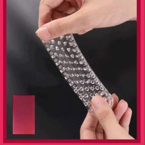 Person holding a flexible sensory strip with texture on a vibrant red background.