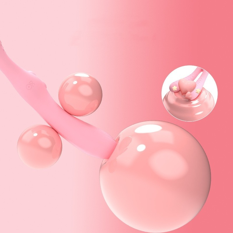 Applicateur rose élégant avec des sphères brillantes, parfait pour une routine beauté ludique.