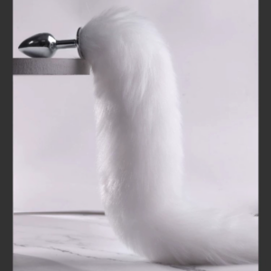 Sleek metallic design with fluffy tail, perfect for playful luxury in intimate moments.