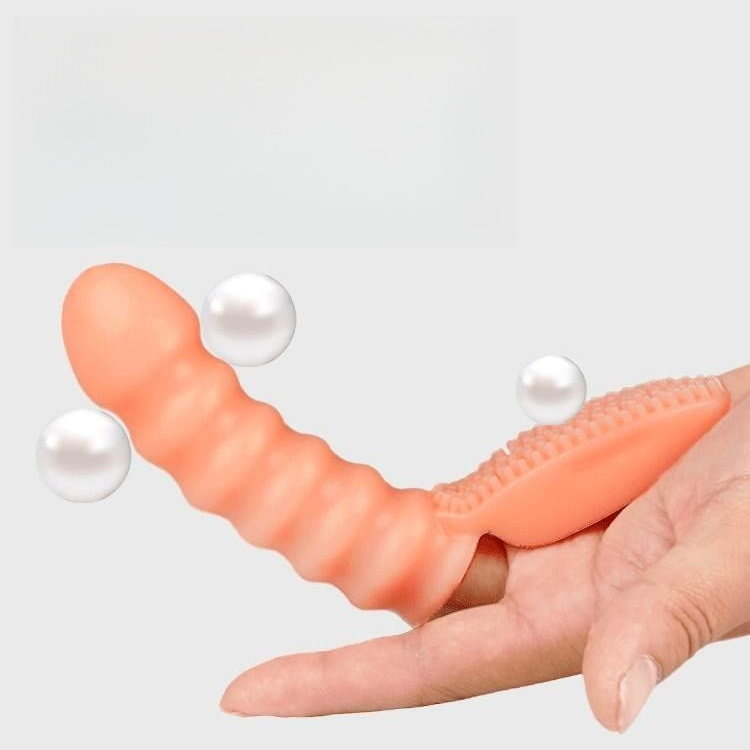 Peach silicone massager with ribbed texture and stimulating pearls for enhanced pleasure.