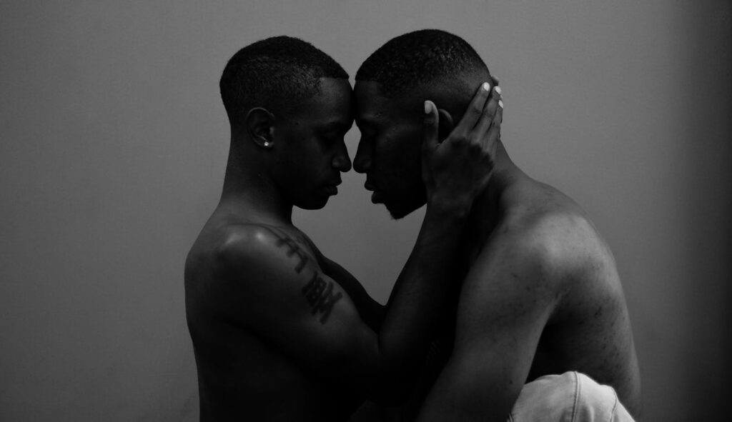 Black and white photo of a couple embracing, showcasing intimacy and love.