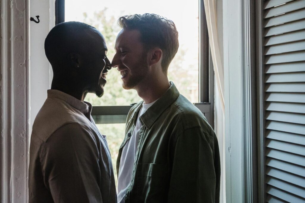 Portrait of Two Men Smiling at each other