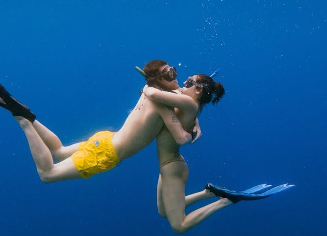 Couple Hugging Underwater