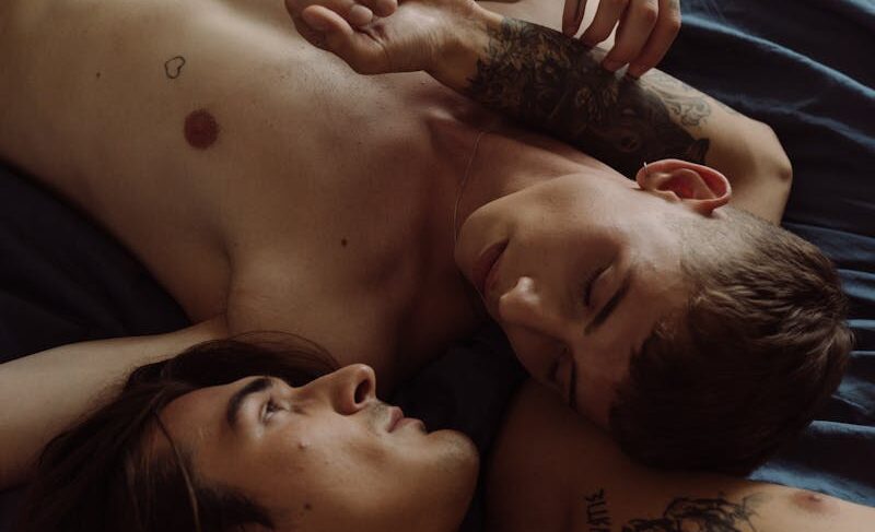 A romantic and intimate moment between two adults embracing in a bedroom setting, showcasing love and connection.