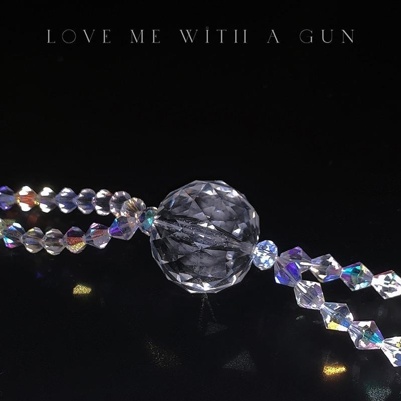 Sparkling glass beads with provocative phrase for an alluring adult store display.