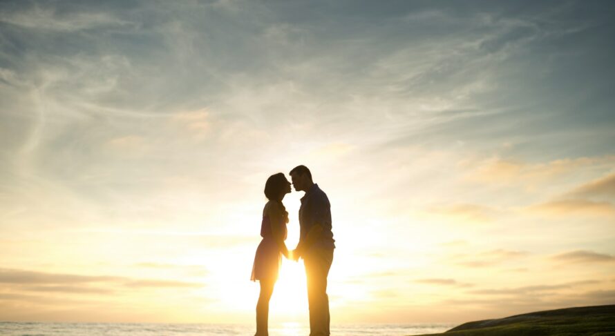 silhouette of man and woman about to kiss