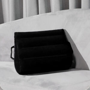 Stylish black cushion on gray sofa, perfect for comfort and modern home decor.