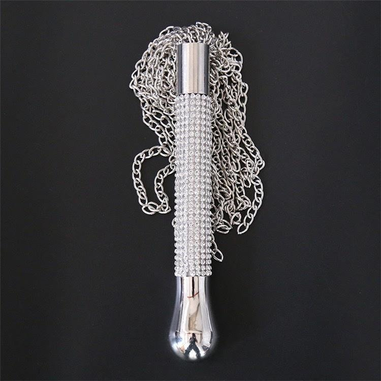 Sleek decorative metallic handle with rhinestones, perfect for enhancing pleasure and style.