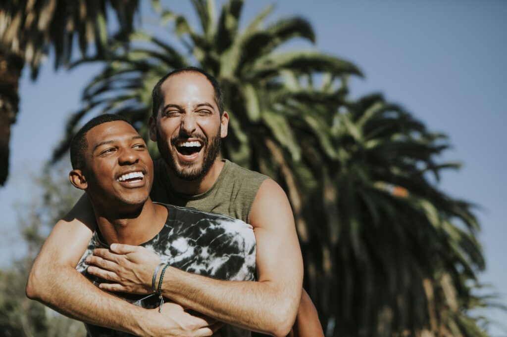 Gay couple hugging in the park