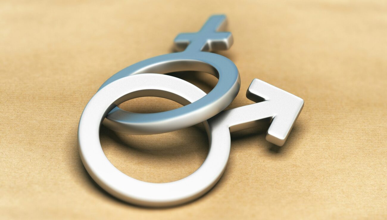 Verweven gendersymbolen: Gelijkheid en eenheid omarmen Geslachtssymbolen, man en vrouw samen.