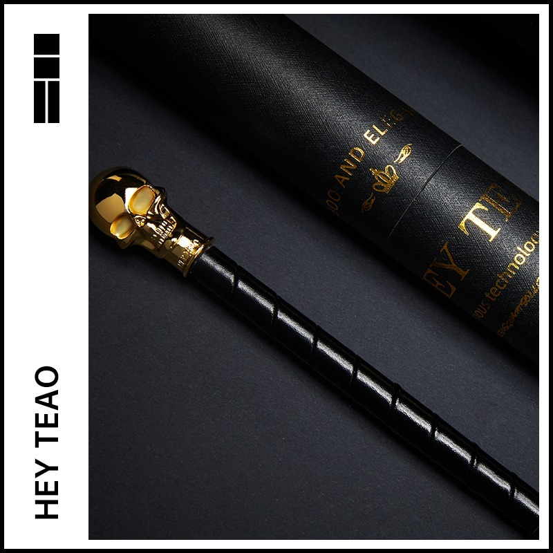 Elegant black wand with golden skull, stylishly housed in a classy black box.