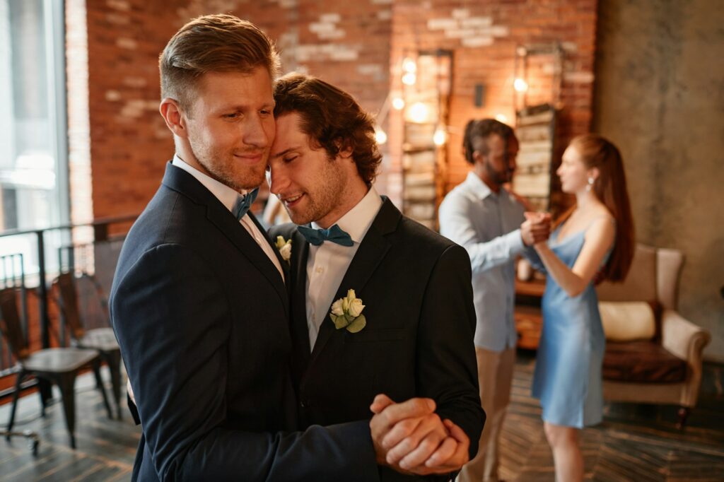 Happy Gay Couple Dancing in Wedding