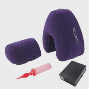 Inflatable purple cushion set with ergonomic neck pillow, pump, and sleek packaging for comfort.