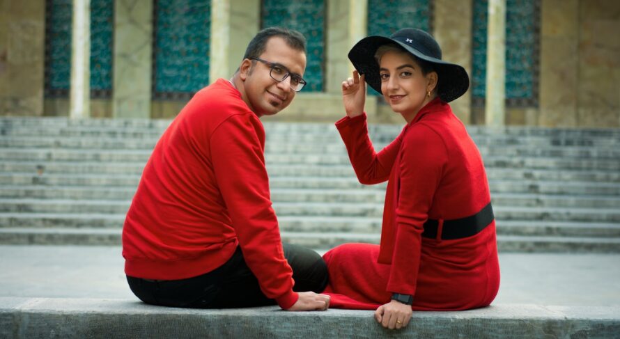 man in red and black long sleeve shirt and black hat