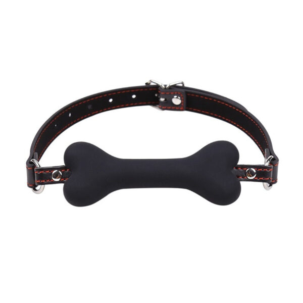 Stylish pet collar with black leather and playful bone centerpiece for fashionable pet lovers.