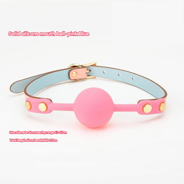 Vibrant pink silicone ball accessory with adjustable strap for playful and stylish use.