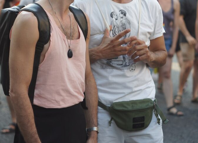 man in white tank top and black tank top