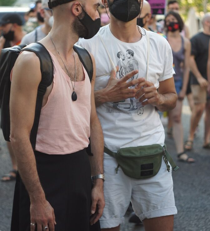 man in white tank top and black tank top