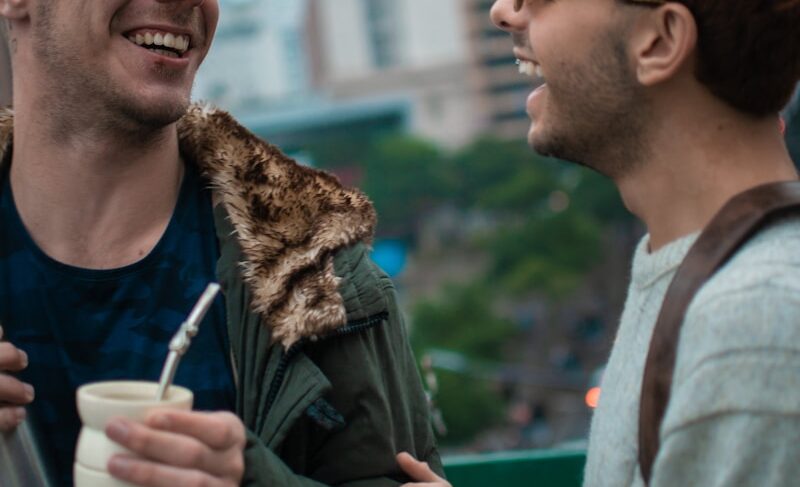 a couple of men standing next to each other