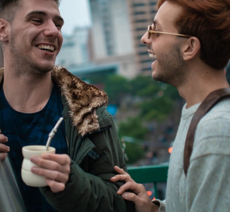 a couple of men standing next to each other