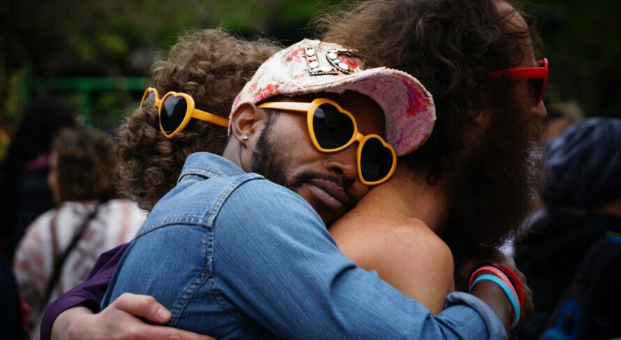 man hugging other man's back