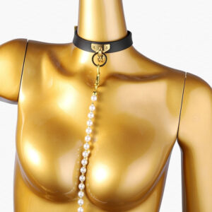 Stylish black choker with pearls on golden mannequin, perfect for elegant adult fashion statements.