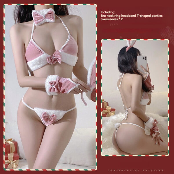 Playful holiday lingerie model with festive attire, showcasing sexy pink and white ensemble.