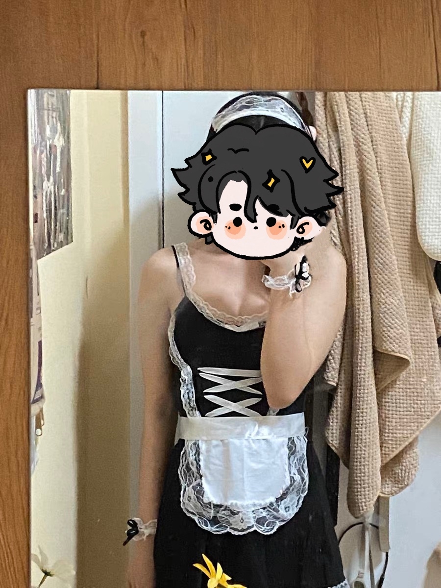 Playful selfie in a cute black maid outfit, featuring a whimsical cartoon face reflection.