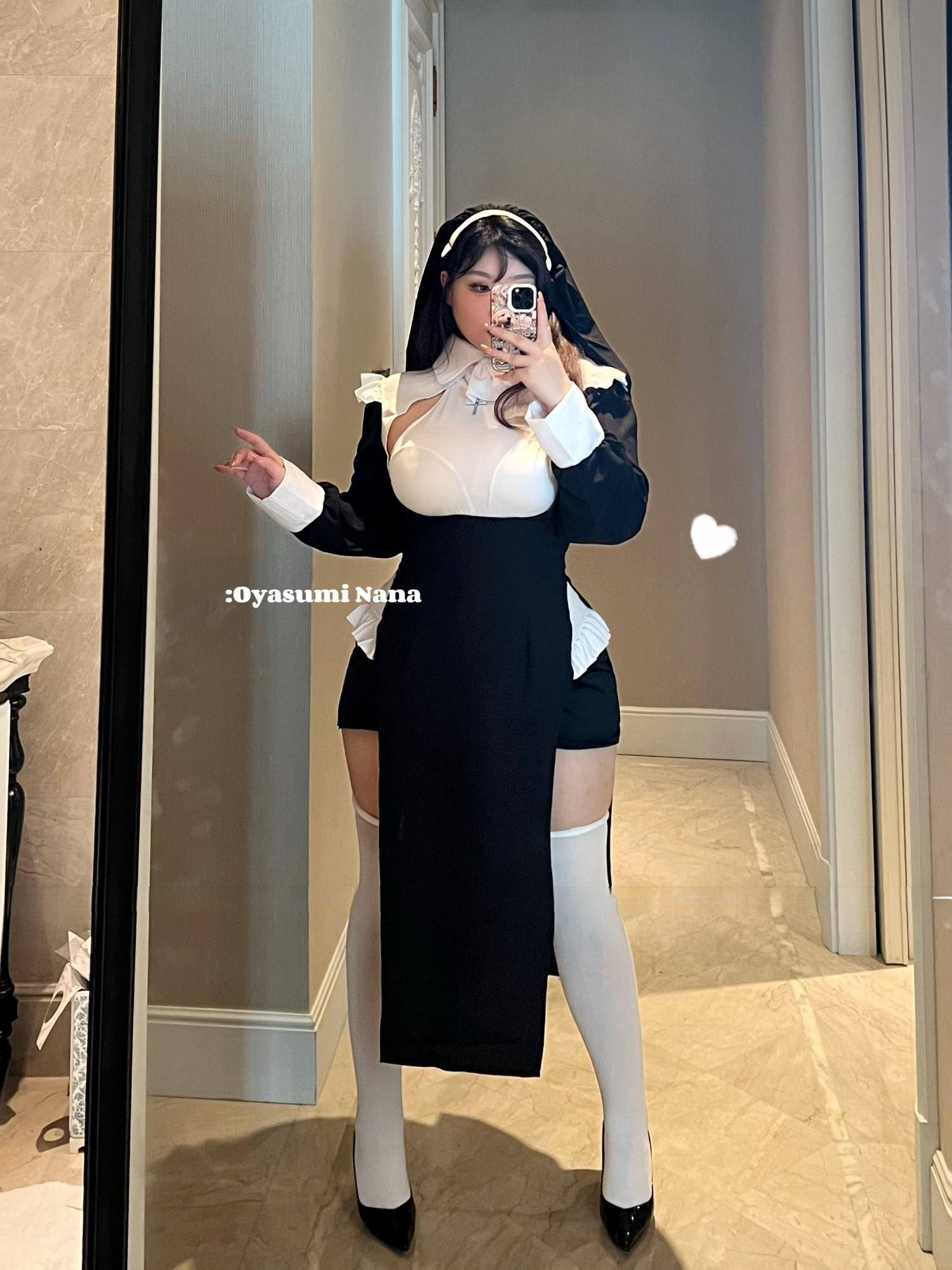 Nun-inspired outfit selfie showcasing playful elegance and modern style in front of a mirror.