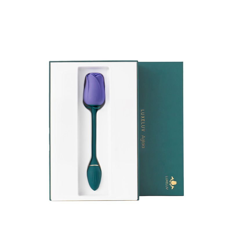 Lussuoso giocattolo in silicone a tulipano color lavanda in un'elegante confezione verde, perfetto per regali e momenti di intimità.