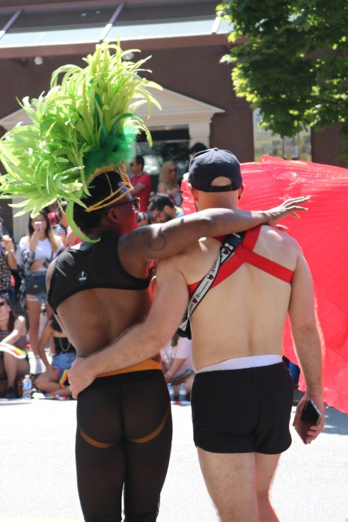 two men walking outside during daytime